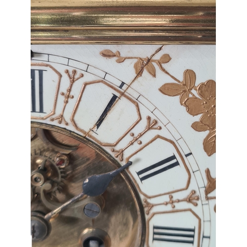 225 - A late 19th Century French brass and porcelain Mantel Clock with pierced spindle gallery above the c... 