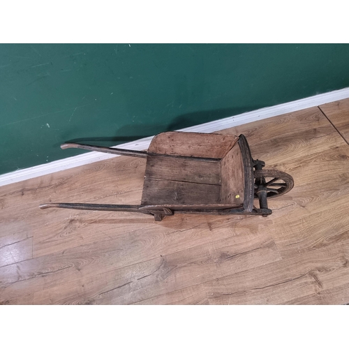 241 - A small painted wooden Wheelbarrow with gilt painted detail 4ft 7in L.