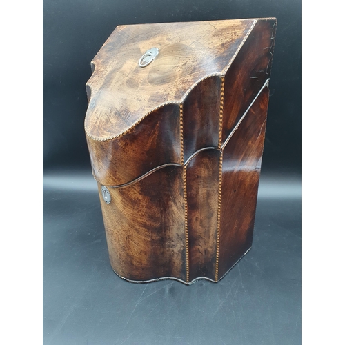 263 - A Georgian mahogany Knife Box of serpentine shape with chequered stringing and fitted interior, 9 1/... 