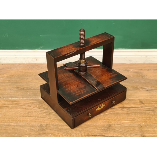 265 - A 19th Century mahogany table-top Book Press with turned wood thread, the base fitted single drawer,... 