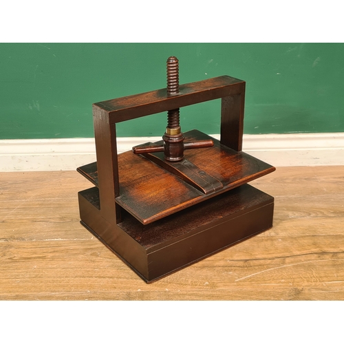 265 - A 19th Century mahogany table-top Book Press with turned wood thread, the base fitted single drawer,... 