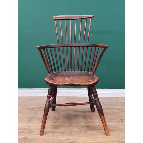 267 - A 19th Century stick back ash and elm Chair with comb top rail raised on turned supports united by H... 