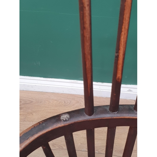 267 - A 19th Century stick back ash and elm Chair with comb top rail raised on turned supports united by H... 