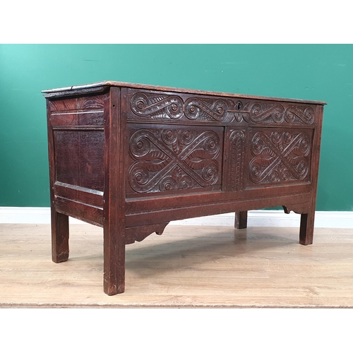 273 - An 17th Century oak Coffer with well carved 'S' scrolls to the frieze and two panelled front 4'1