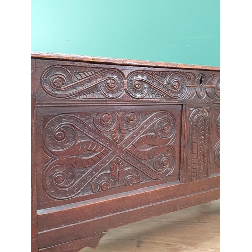 273 - An 17th Century oak Coffer with well carved 'S' scrolls to the frieze and two panelled front 4'1