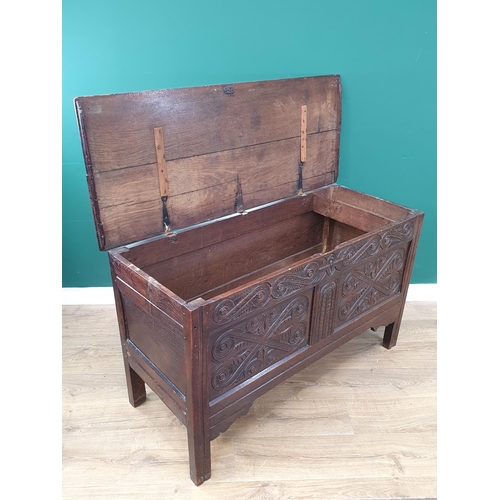 273 - An 17th Century oak Coffer with well carved 'S' scrolls to the frieze and two panelled front 4'1