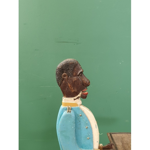 275 - A 20th Century painted wooden Dumb Waiter in the form of a Butler holding a tray, with carved hair a... 