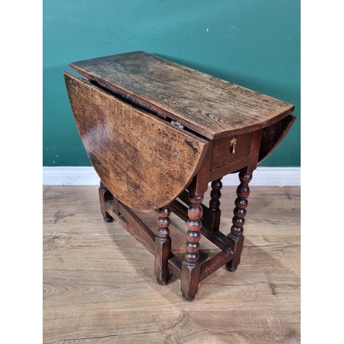 280 - A 17th Century oak Gateleg Table of small proportions fitted single end drawer raised on bobbin turn... 