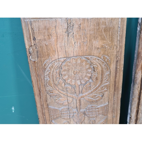 281 - A pair of 16th Century Cedar Panels, carved stylised flowers and thistle heads, 2ft 10in H x 11in W