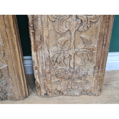 281 - A pair of 16th Century Cedar Panels, carved stylised flowers and thistle heads, 2ft 10in H x 11in W