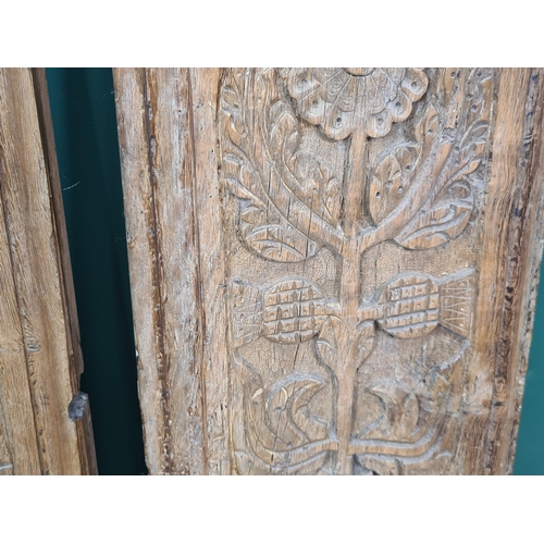 281 - A pair of 16th Century Cedar Panels, carved stylised flowers and thistle heads, 2ft 10in H x 11in W