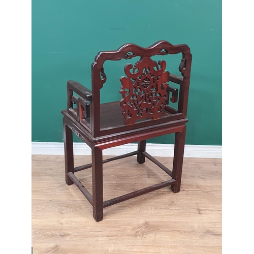 290 - A Chinese hardwood carved Elbow Chair with pierced and carved splat back, solid seat raised on squar... 