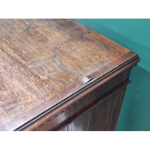 292 - A 19th Century oak and chequer banded Chest with a blind fret carved secret frieze drawer above thre... 