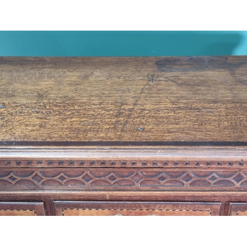 292 - A 19th Century oak and chequer banded Chest with a blind fret carved secret frieze drawer above thre... 