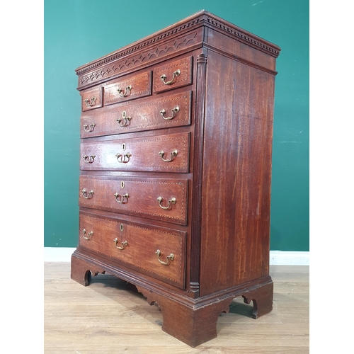 292 - A 19th Century oak and chequer banded Chest with a blind fret carved secret frieze drawer above thre... 