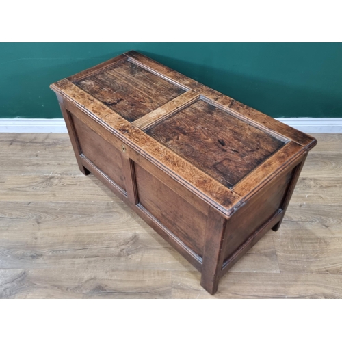 293 - A small 18th Century Oak Coffer with panelled top and front, the interior fitted Candle Box, 3ft 6in... 