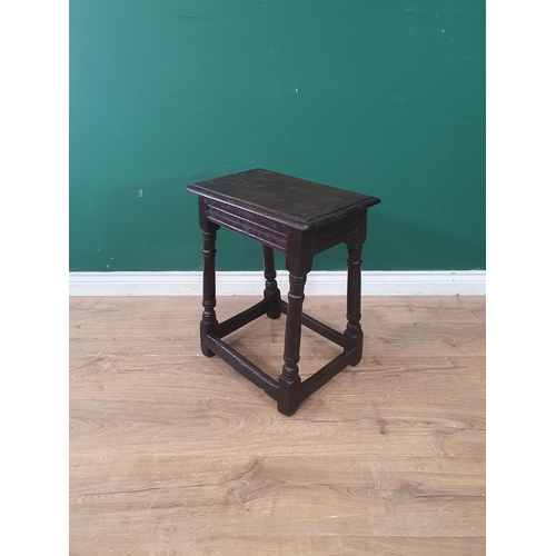 296 - A 17th Century and later oak Joint Stool with moulded top raised on barrel turned supports united by... 