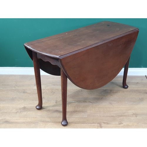 298 - A large 18th Century mahogany Dropleaf Table with oval top on turned supports and pad feet 4'6