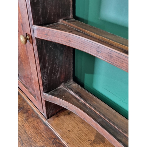 302 - An antique oak Dresser and Rack crossbanded in mahogany, the base fitted three drawers on turned sup... 