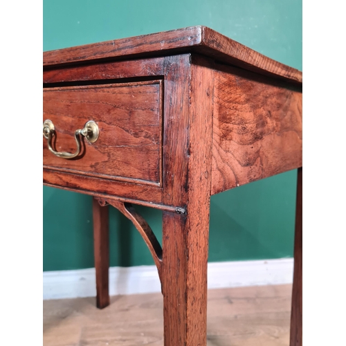 303 - A late Georgian oak Side Table fitted one long drawer on square tapering legs, having pierced corner... 