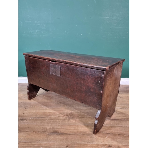 304 - A 17th Century oak six-plank Chest with plain lid on strap hinges above plain front all raised on V-... 