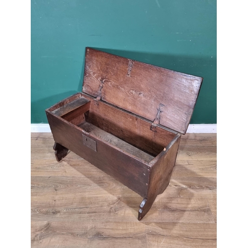 304 - A 17th Century oak six-plank Chest with plain lid on strap hinges above plain front all raised on V-... 