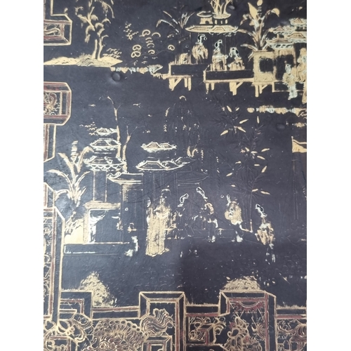 306 - A 19th Century chinoiserie ebonised and gilt Sewing/Work Table decorated figures and temples in a la... 