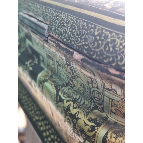 306 - A 19th Century chinoiserie ebonised and gilt Sewing/Work Table decorated figures and temples in a la... 