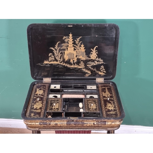 306 - A 19th Century chinoiserie ebonised and gilt Sewing/Work Table decorated figures and temples in a la... 