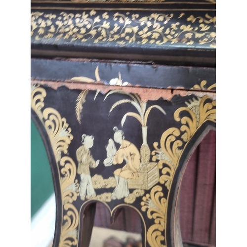 306 - A 19th Century chinoiserie ebonised and gilt Sewing/Work Table decorated figures and temples in a la... 