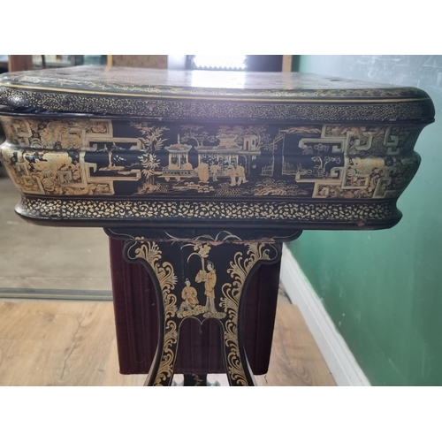 306 - A 19th Century chinoiserie ebonised and gilt Sewing/Work Table decorated figures and temples in a la... 