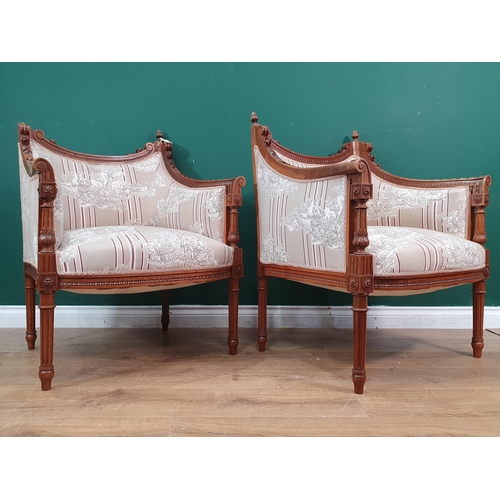 311 - A pair of French walnut and upholstered Armchairs with shaped and carved backs (one finial A/F), scr... 