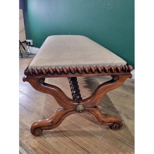 314 - A William IV rosewood and upholstered Window Seat with spiral carved seat edge on cross frame connec... 