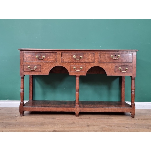 317 - A small antique oak Dresser Base with moulded top above three drawers, two small drawers and a dummy... 