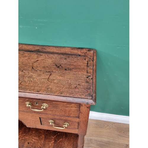 317 - A small antique oak Dresser Base with moulded top above three drawers, two small drawers and a dummy... 