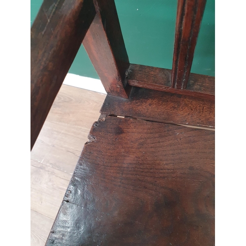 320 - An 18th Century oak child's High Chair with slat back, sabre rear legs and square front supports 3ft... 