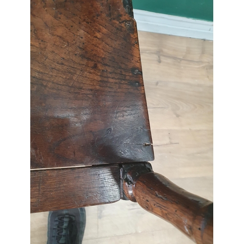 320 - An 18th Century oak child's High Chair with slat back, sabre rear legs and square front supports 3ft... 