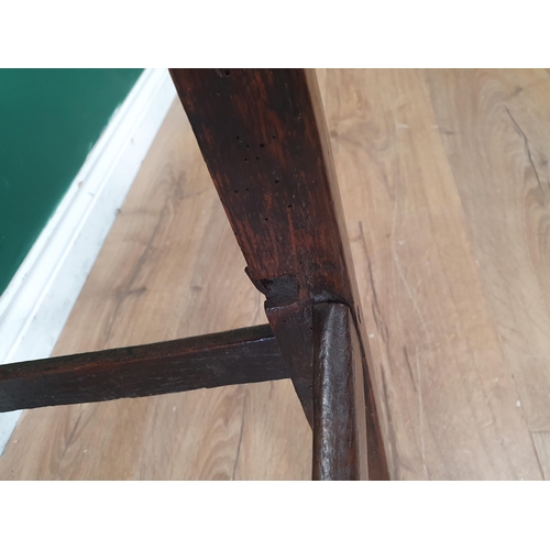 320 - An 18th Century oak child's High Chair with slat back, sabre rear legs and square front supports 3ft... 