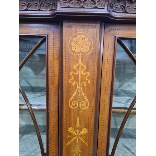 326 - An Edwardian mahogany and glazed Display Cabinet with shell, torch and swag satinwood inlay fitted p... 