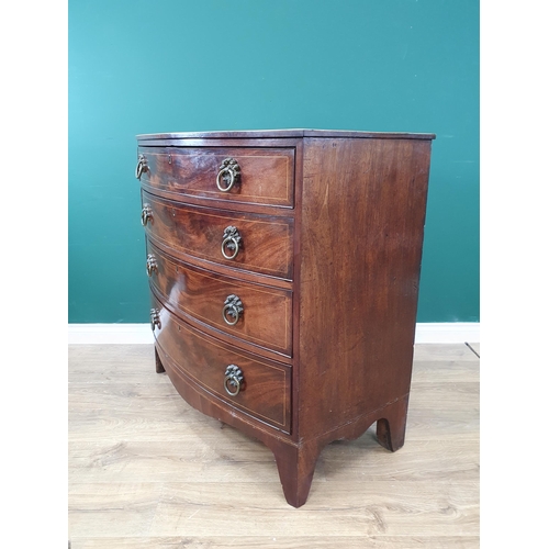 327 - A Regency mahogany and rosewood crossbanded bow fronted Chest of four graduated long drawers with ri... 