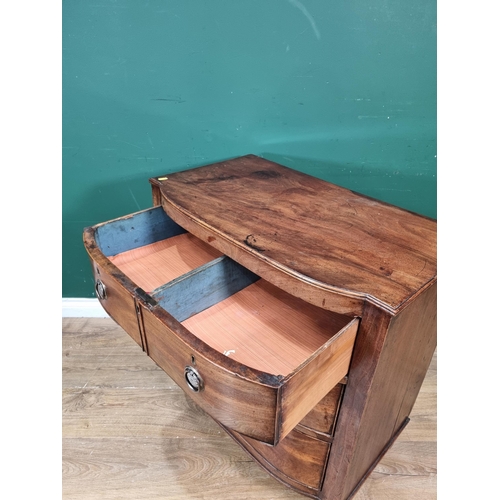 329 - An early 19th Century mahogany D-shape Chest of two short and two long drawers on square tapering le... 