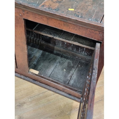 330 - A 17th Century Welsh oak Spindle Cupboard fitted pair of cupboard doors with turned spindle filled w... 