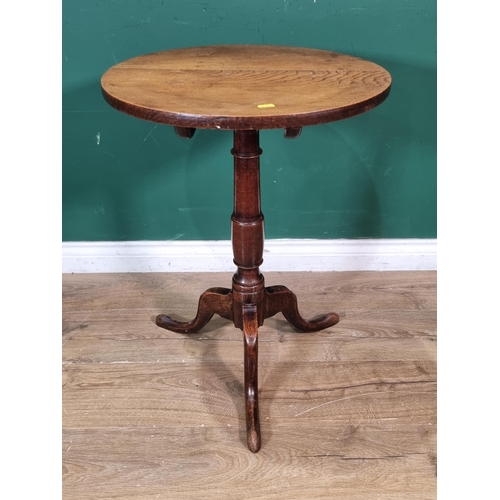 332 - An 18th Century elm topped circular Candle Table on turned column and tripod supports 2ft 3in H x 1f... 