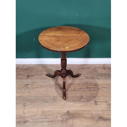 332 - An 18th Century elm topped circular Candle Table on turned column and tripod supports 2ft 3in H x 1f... 