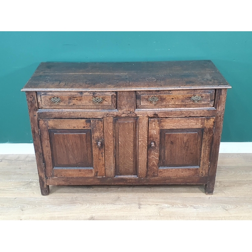 339 - An 18th Century oak enclosed Dresser Base fitted two frieze drawers above pair of fielded panel door... 