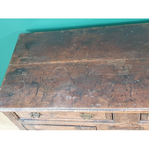 339 - An 18th Century oak enclosed Dresser Base fitted two frieze drawers above pair of fielded panel door... 