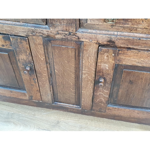 339 - An 18th Century oak enclosed Dresser Base fitted two frieze drawers above pair of fielded panel door... 