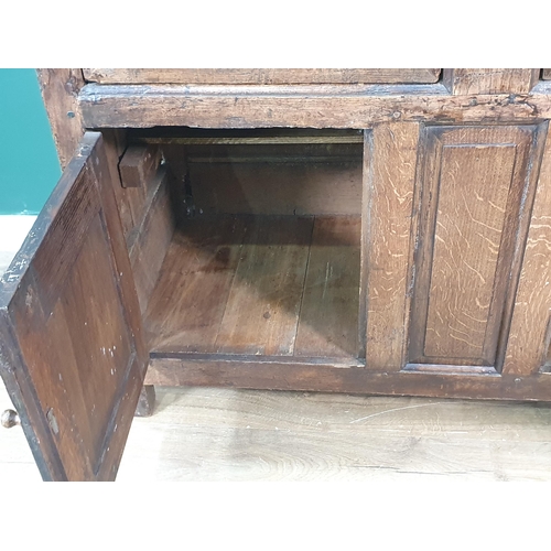 339 - An 18th Century oak enclosed Dresser Base fitted two frieze drawers above pair of fielded panel door... 