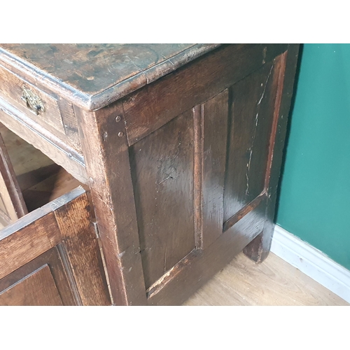 339 - An 18th Century oak enclosed Dresser Base fitted two frieze drawers above pair of fielded panel door... 