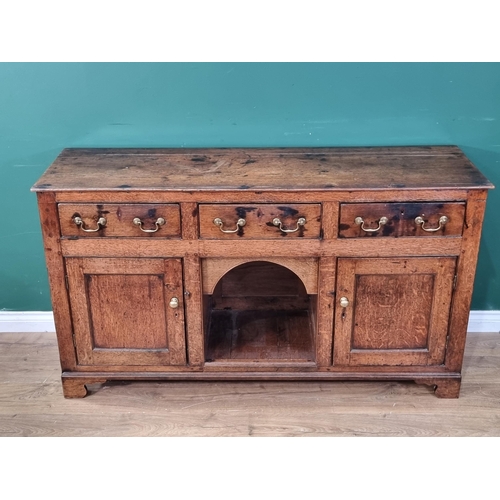 346 - An 18th Century oak Dog Kennel Dresser fitted three drawers above the arched recess flanked by a pai... 